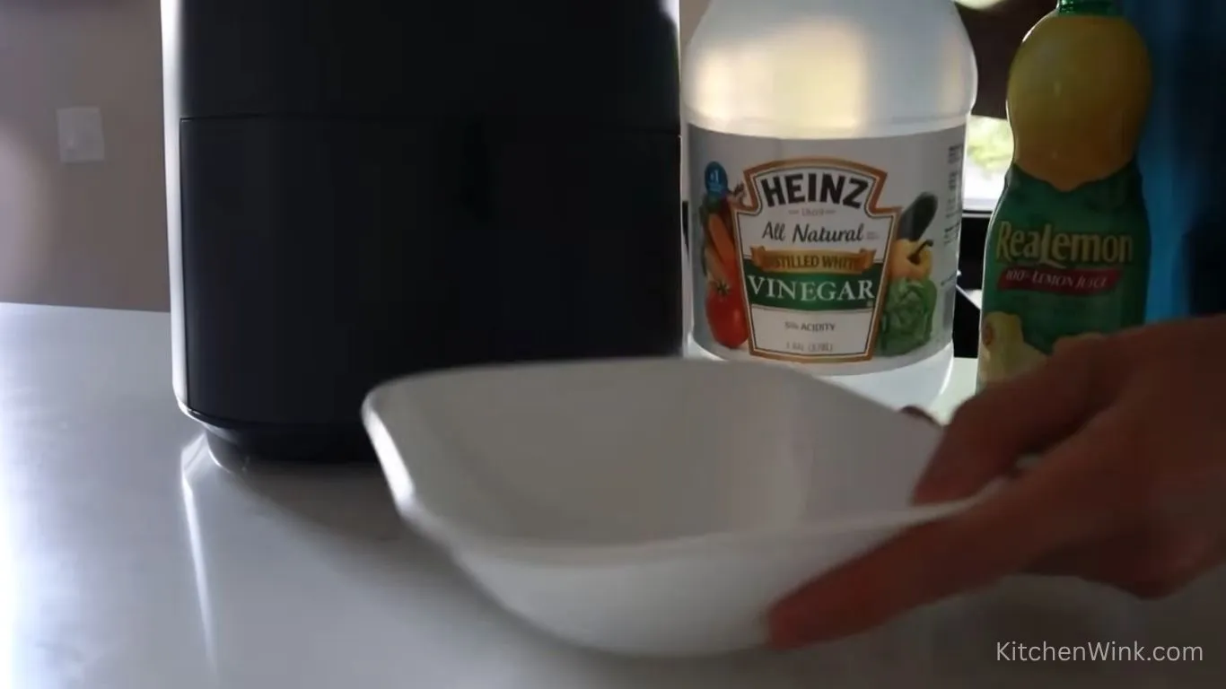 Clean air fryer with vinegar and baking soda
